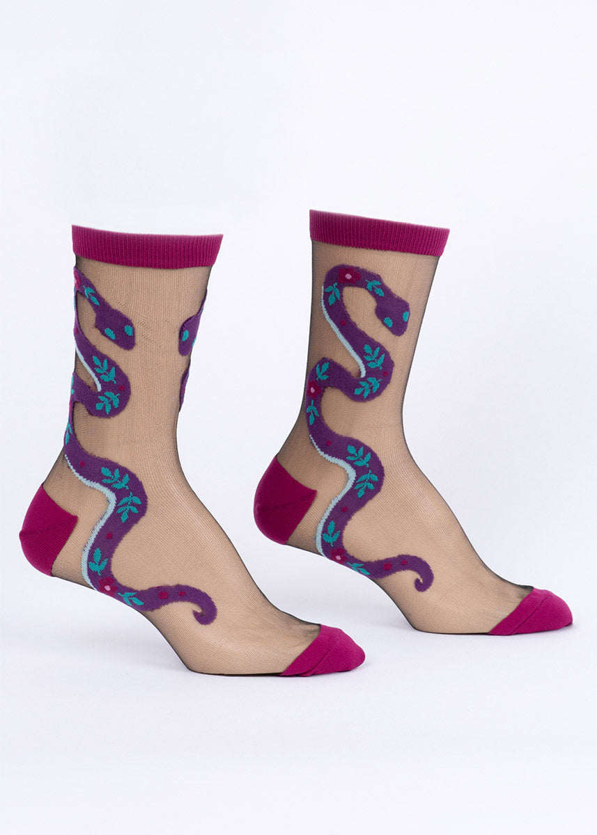Sheer black crew socks with magenta accents, each featuring a purple snake embellished with floral designs.