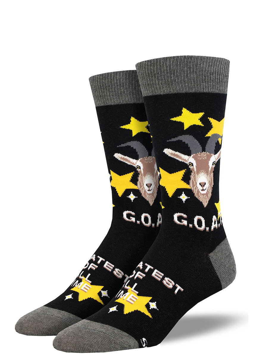 Black crew socks for men with a portrait of a goat on the leg, surrounded by yellow stars and the acronym &quot;G.O.A.T.,&quot; the “Greatest of All Time.&quot;