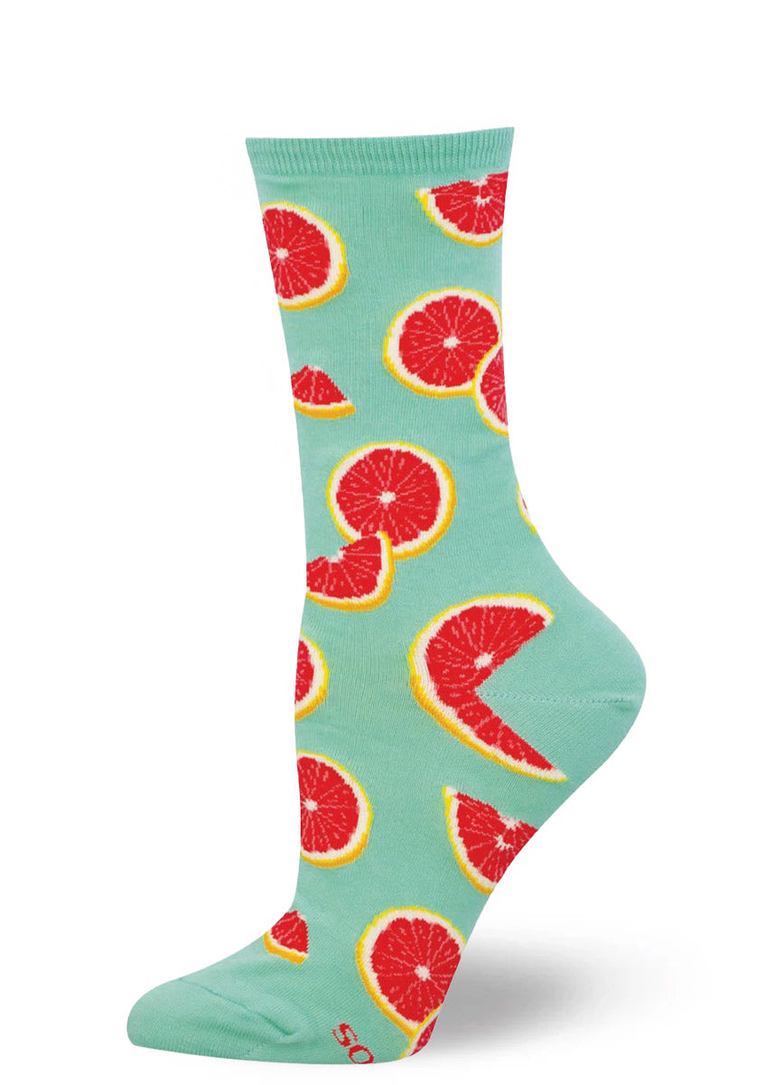 Light mint or aqua sock with red grapefruit patterns on a white background.