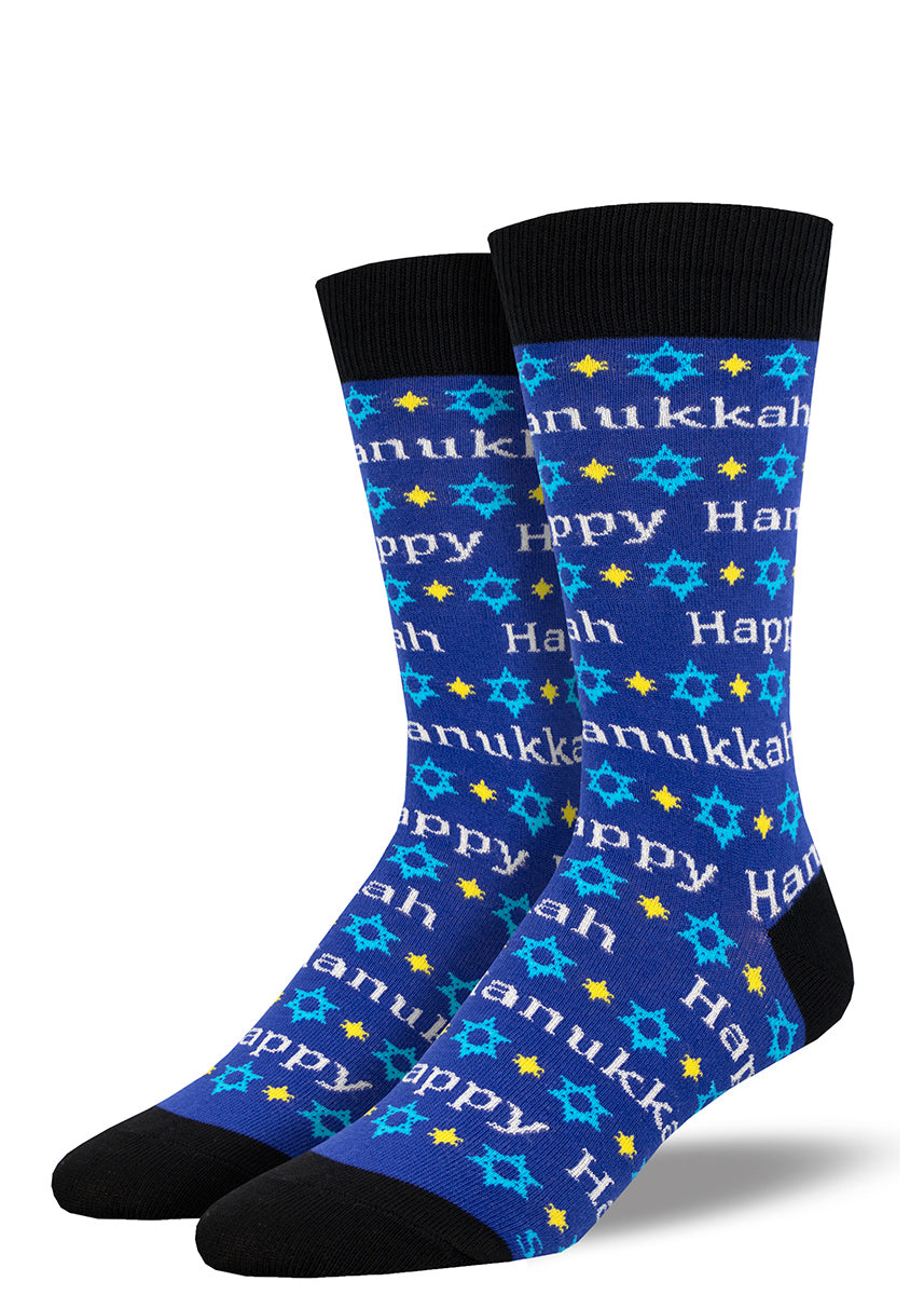 Blue novelty holiday crew socks for men featuring a repeating pattern of the Star of David and the words "Happy Hanukkah" written in silver.