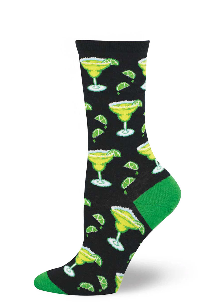 Women's crew sock with allover margarita pattern on a black background with green accents.