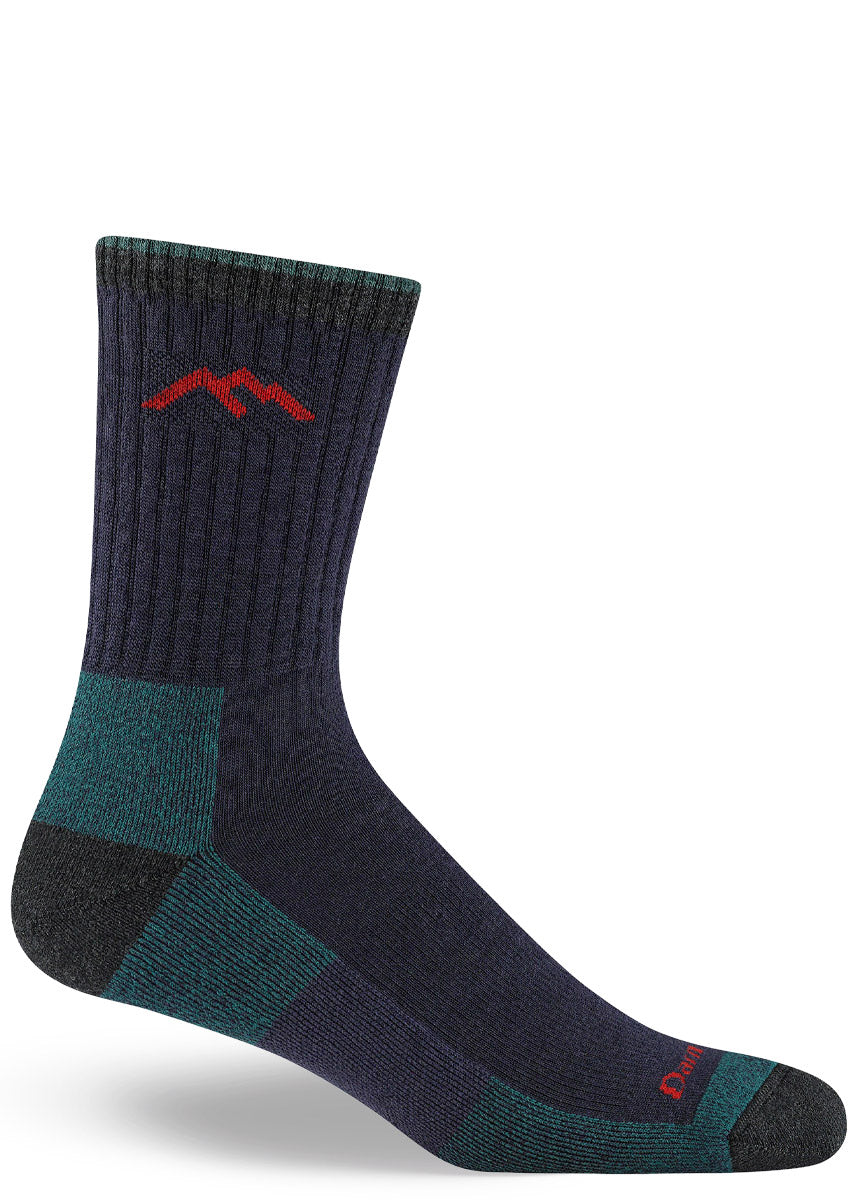 Deep purple hiking socks for men in crew length with teal, charcoal, and red accents. 