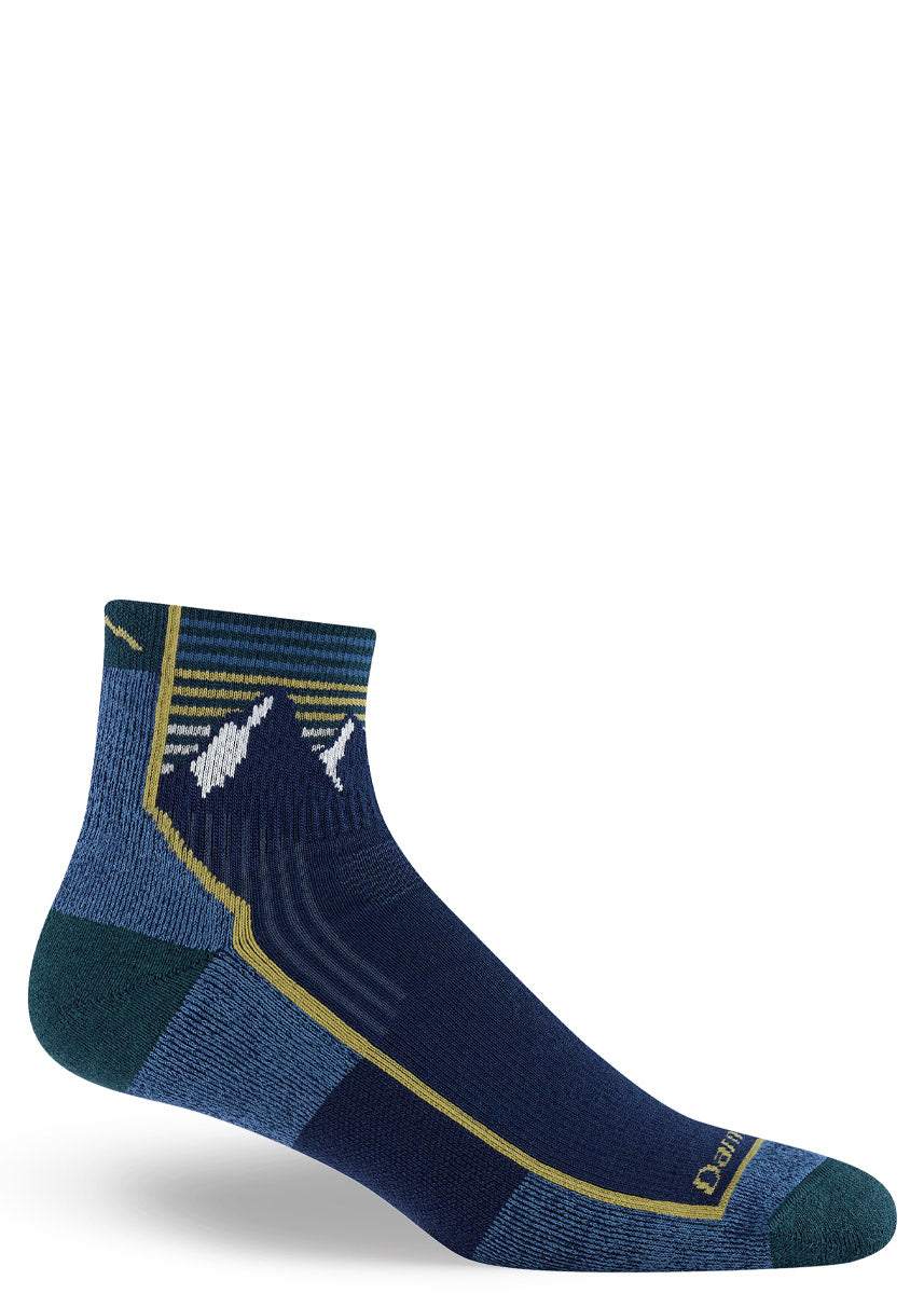Blue ankle sock with snow-capped mountain peaks design and yellow striped accents on a white background.
