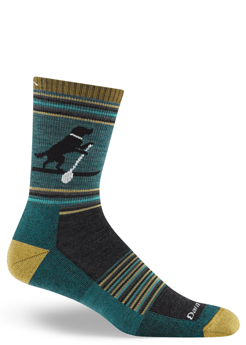Teal men's wool crew sock with black Lab dog paddleboarding design, accented with gold and charcoal stripes.