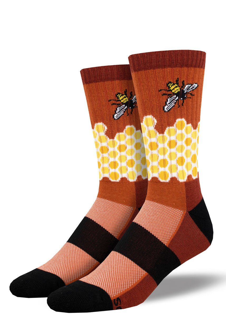 Red, yellow, and black wool hiking socks for men featuring a honeycomb pattern and bee design.