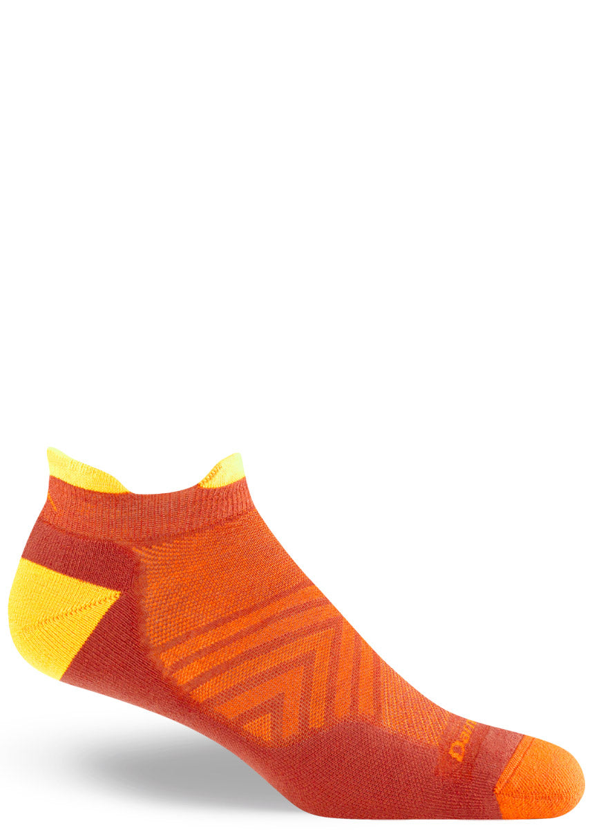 Wool running socks for men feature a lightly cushioned ankle-length design of orange, dark orange, and yellow.