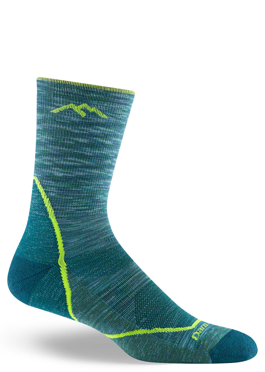 Teal hiking crew socks for men made of space-dyed merino wool with lime green accents.