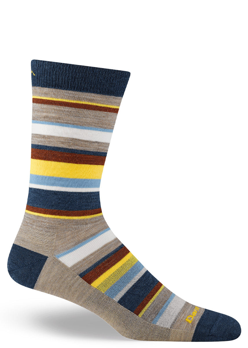 Multicolored striped men's crew sock on a white background.