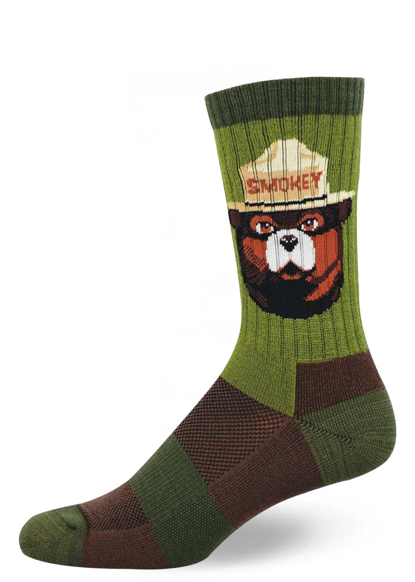 Wool men's crew sock with Smokey Bear design and in shades of green and brown.