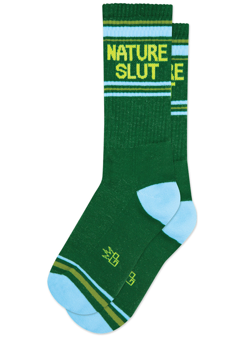 Dark green retro gym socks with light green and blue stripes and the phrase “NATURE SLUT."