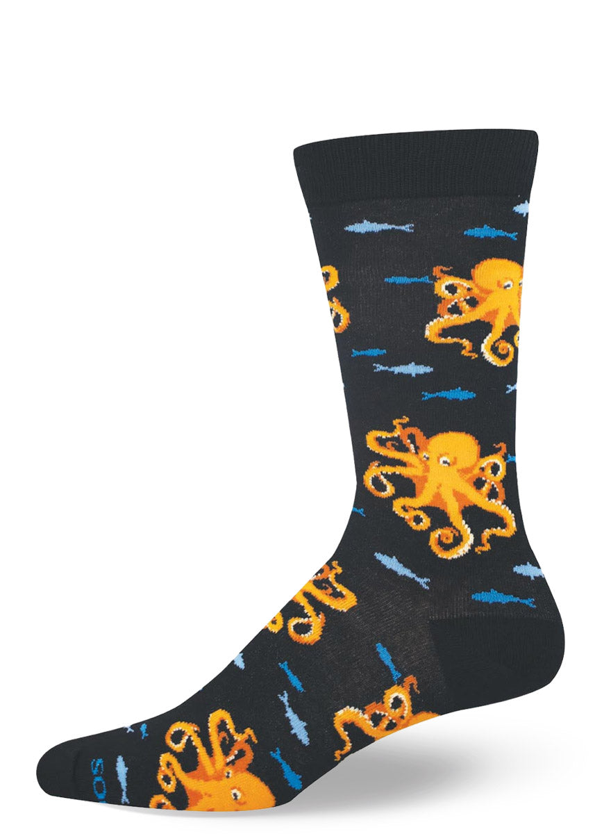 Black men's crew sock with orange octopus design on a white background.