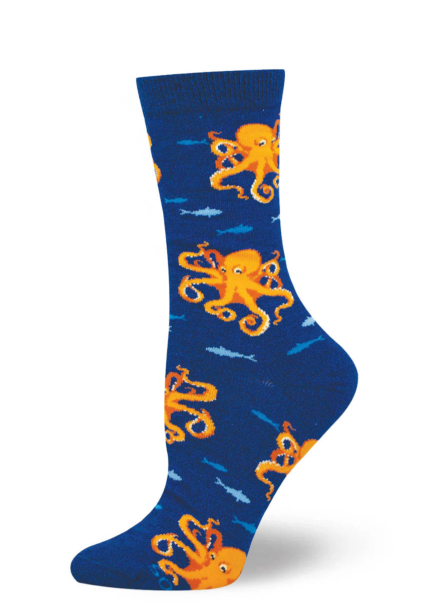 Dark blue women's crew sock with orange octopus and blue fish pattern on a white background.