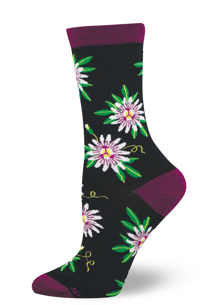 Black passion flower floral-patterned sock with deep magenta accents on a white background.