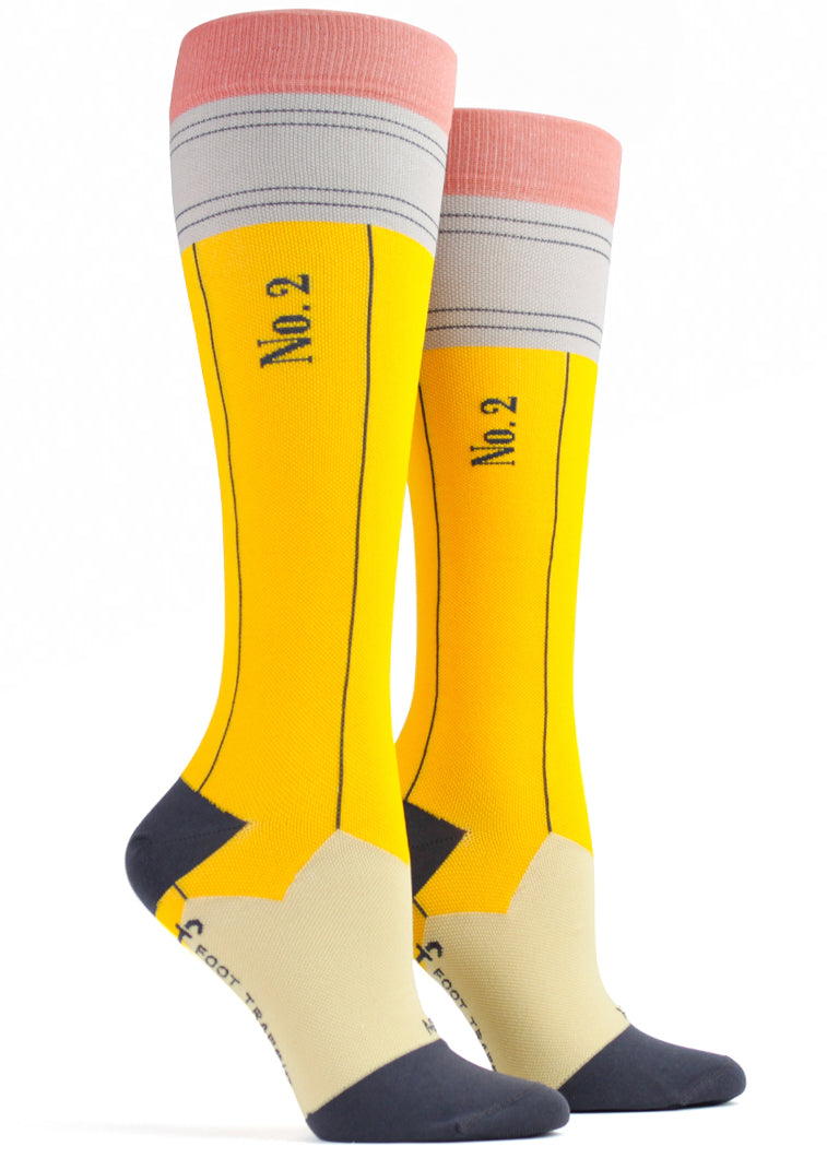 Compression knee socks that look like a yellow No. 2 pencil, complete with the "lead" point at the toe and a pink "eraser" at the cuff. 