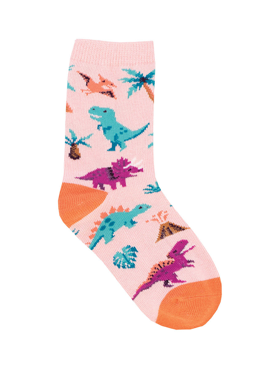Pink kids&#39; crew socks with dinosaurs in turquoise blue and magenta with orange accents.