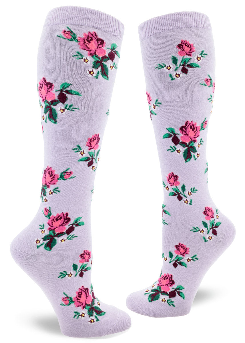 Light purple knee socks for women that have an allover pattern of pink roses and white floral accents.