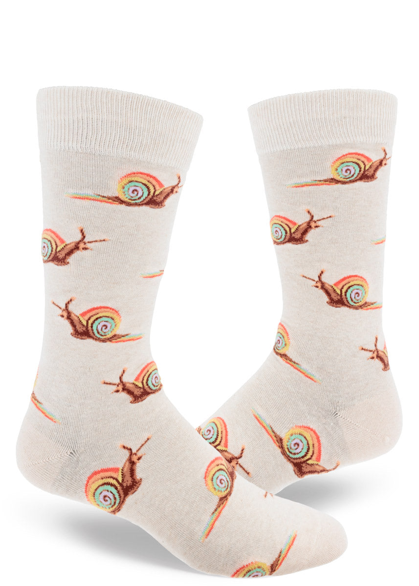 Cream crew socks for men with an allover pattern of brown snails with pastel rainbow shells leaving a rainbow slime trail behind them.
