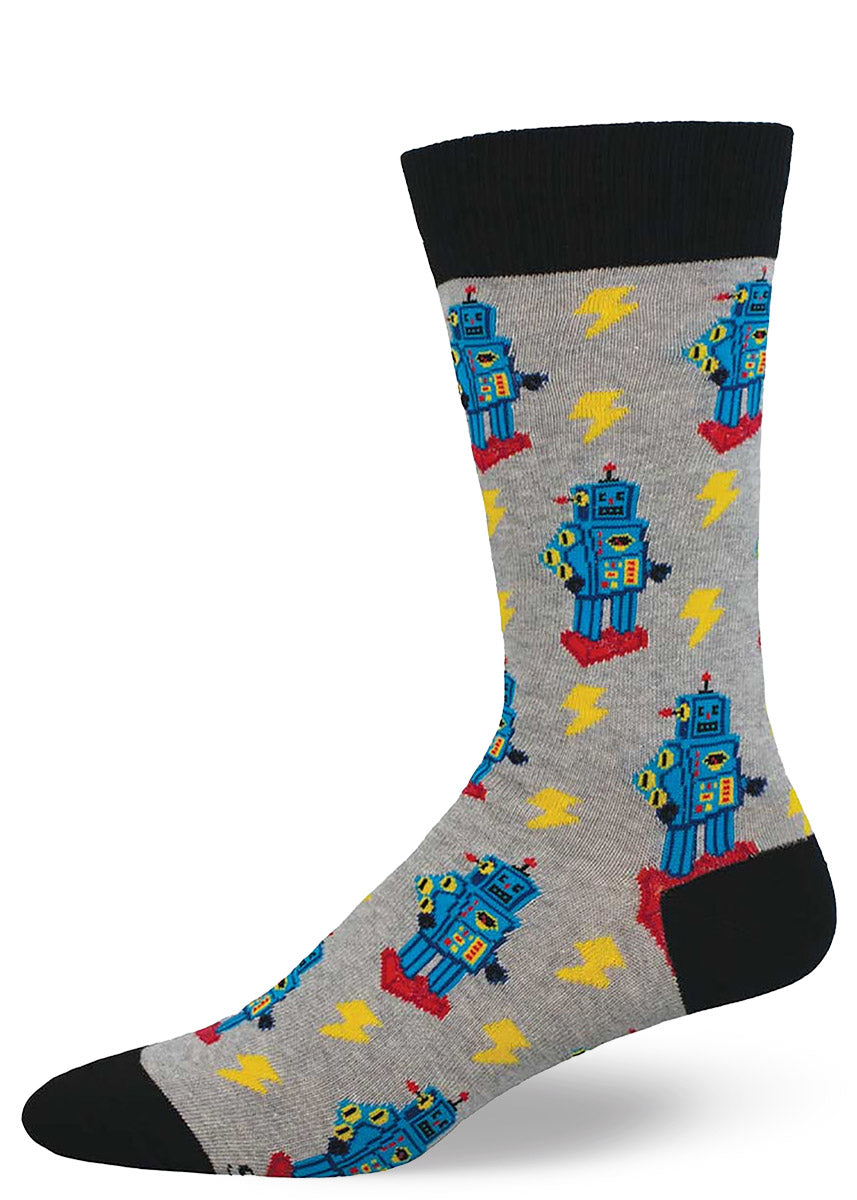 Light gray crew socks for men with an allover pattern of blue and red toy robots and yellow lightning bolts.