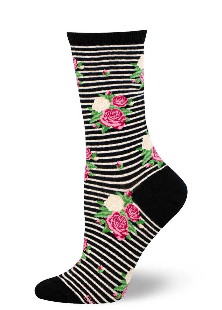 Black and white striped socks with pink rose floral designs on a white background.