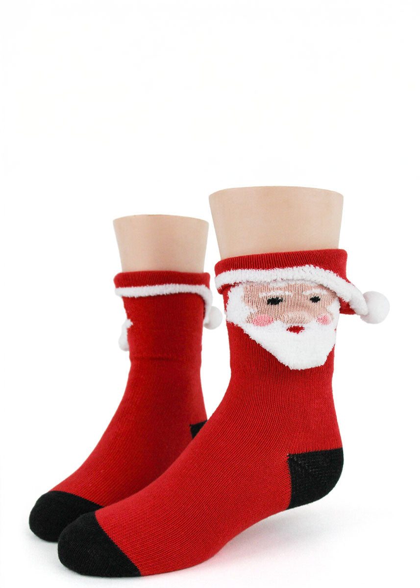 Red kids' crew socks with 3D Santa face design knit into the cuff.