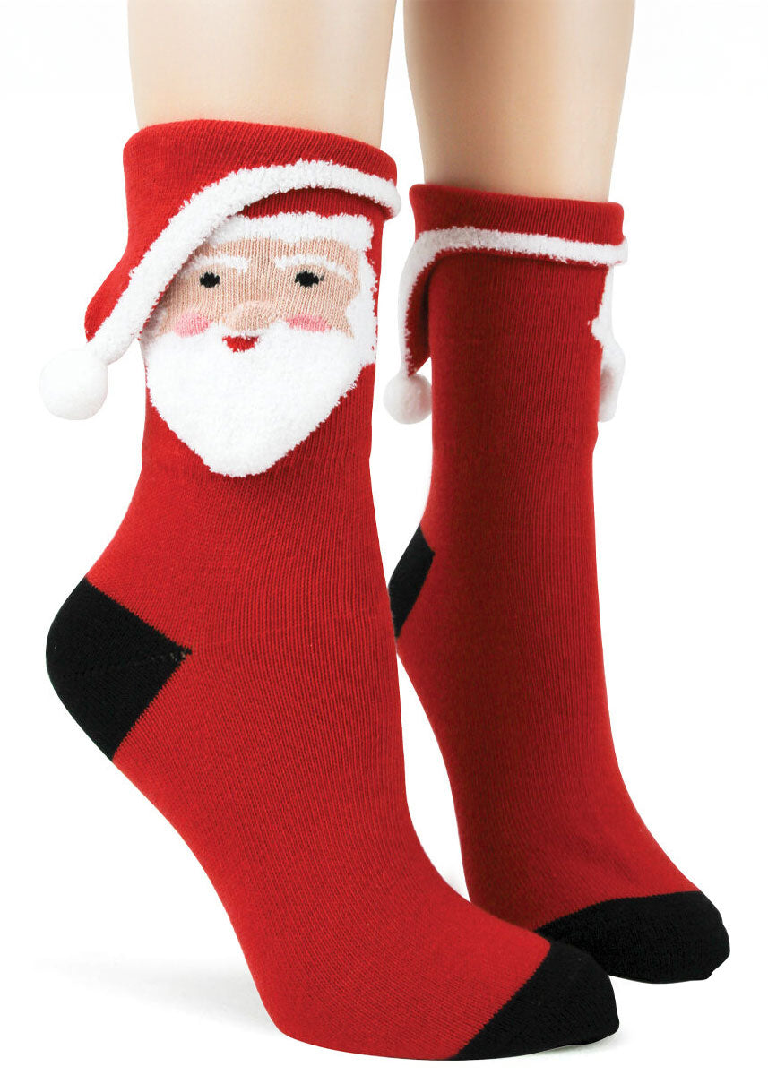 Red women's crew socks with 3D Santa face design knit into the cuff.