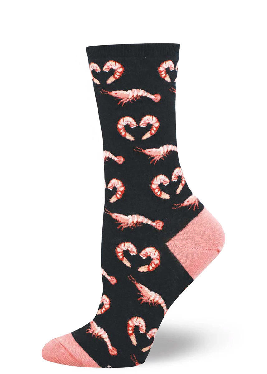 Black women&#39;s crew sock with a pattern of pink shrimp.