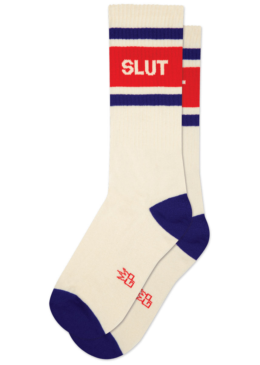Cream-colored athletic crew socks with red and blue accents and the word 'SLUT' on a white background.