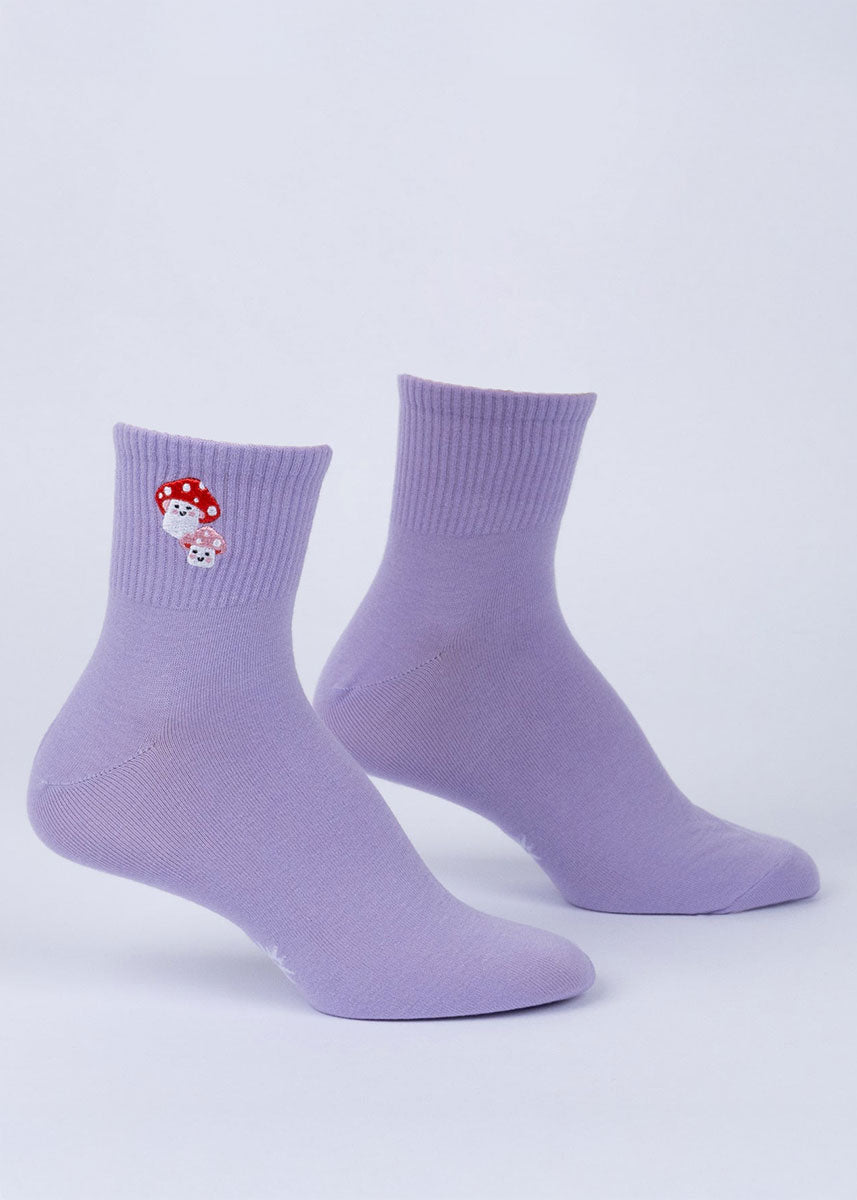 Solid purple quarter ankle socks with a ribbed cuff featuring a pair of embroidered toadstool mushrooms.