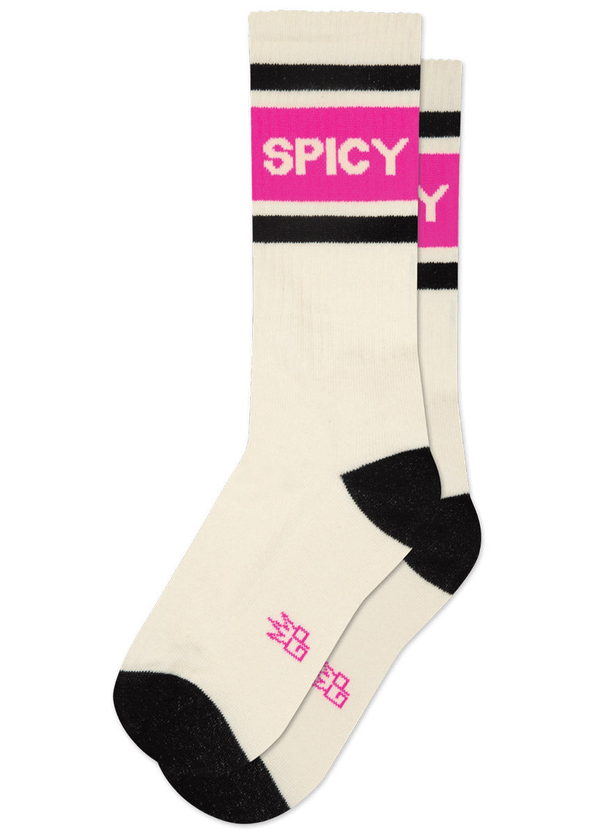 Cream-colored socks with black and hot pink stripes and 'SPICY' text on a white background.