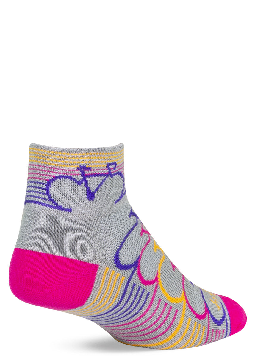 Light gray athletic ankle socks for women with a pattern of repeating stripes and bicycles in pink, yellow, and purple.