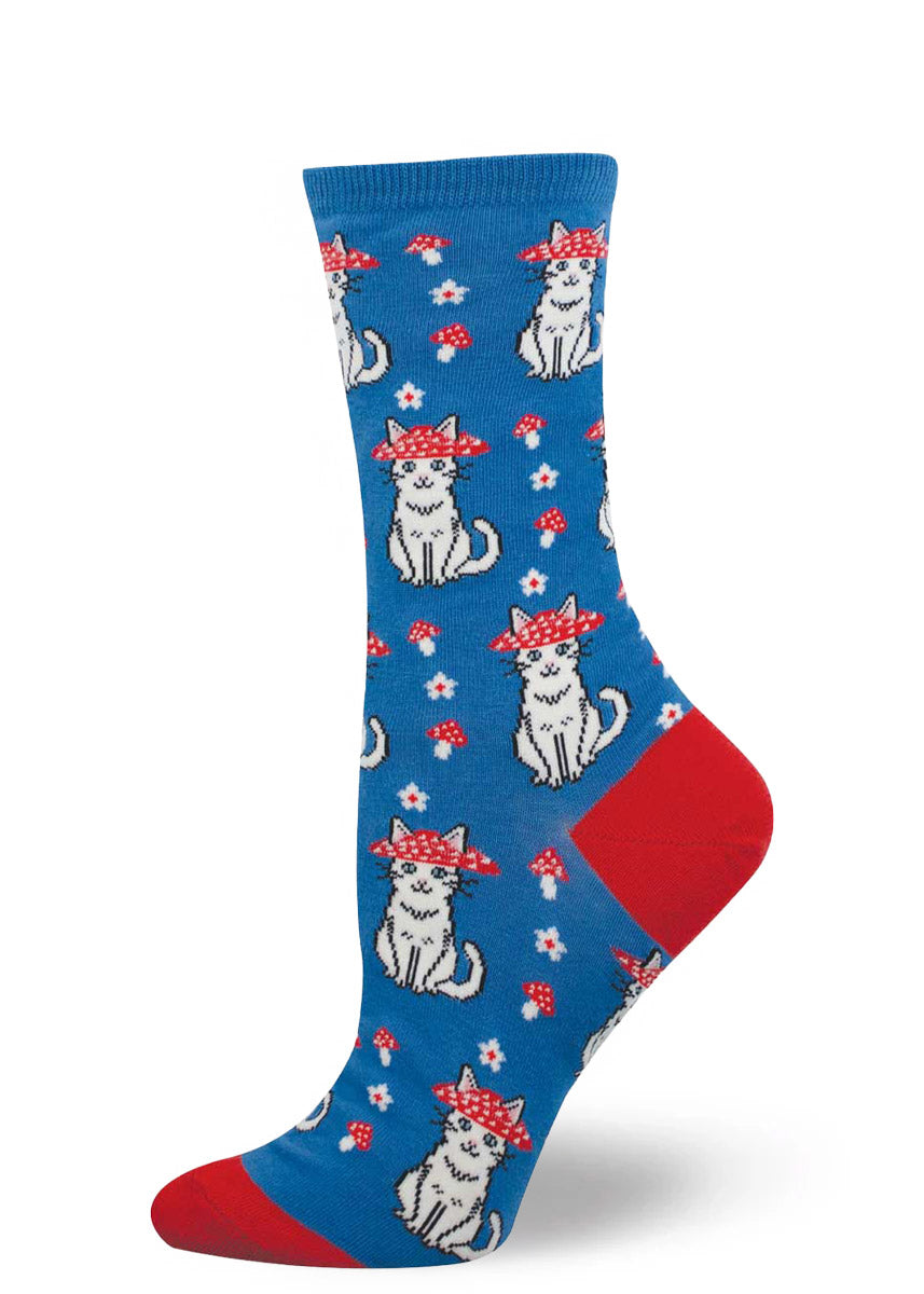 Blue women's crew sock with a pattern of white cats with red mushroom hats, toadstools and flowers.