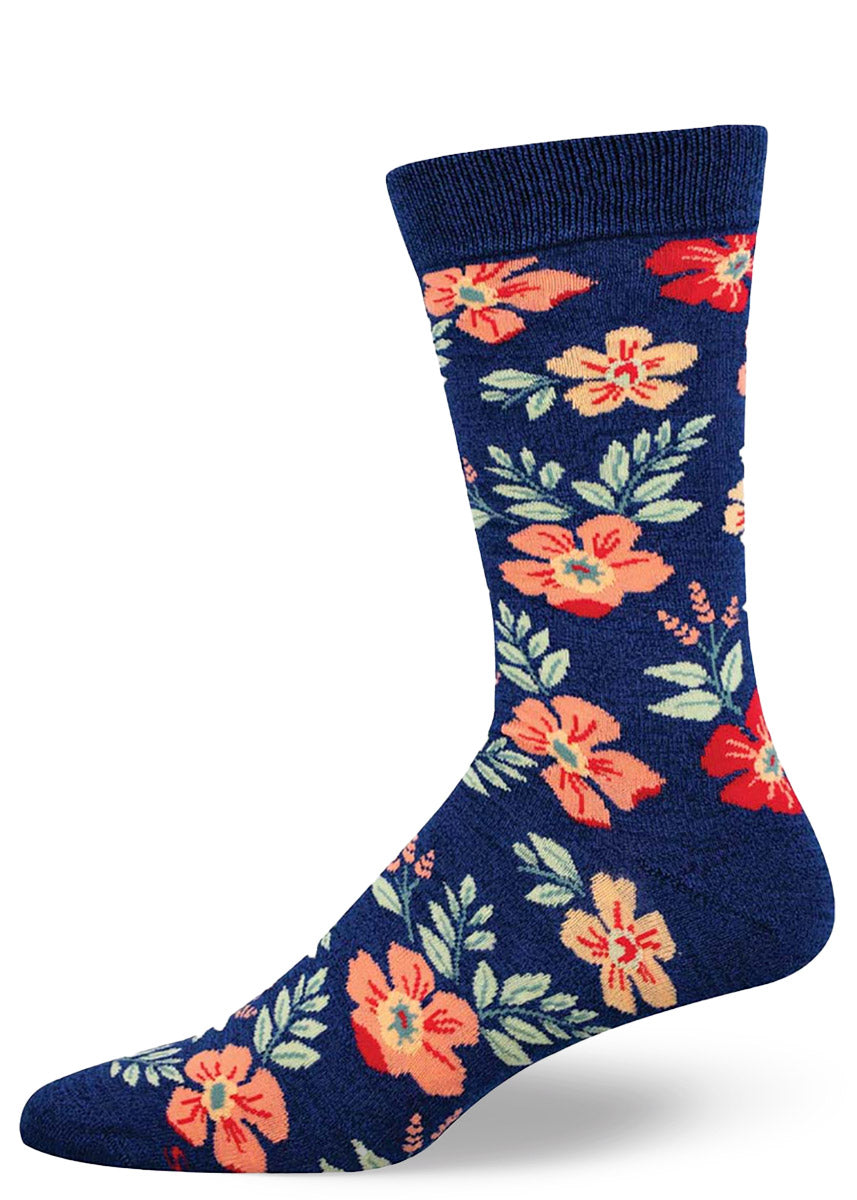 Dark blue crew socks for men with an allover pattern of wildflowers in shades of pink, red, and orange and light green foliage.