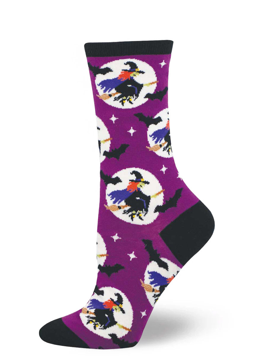 Purple sock with witch designs, accented with black bats, on a white background.