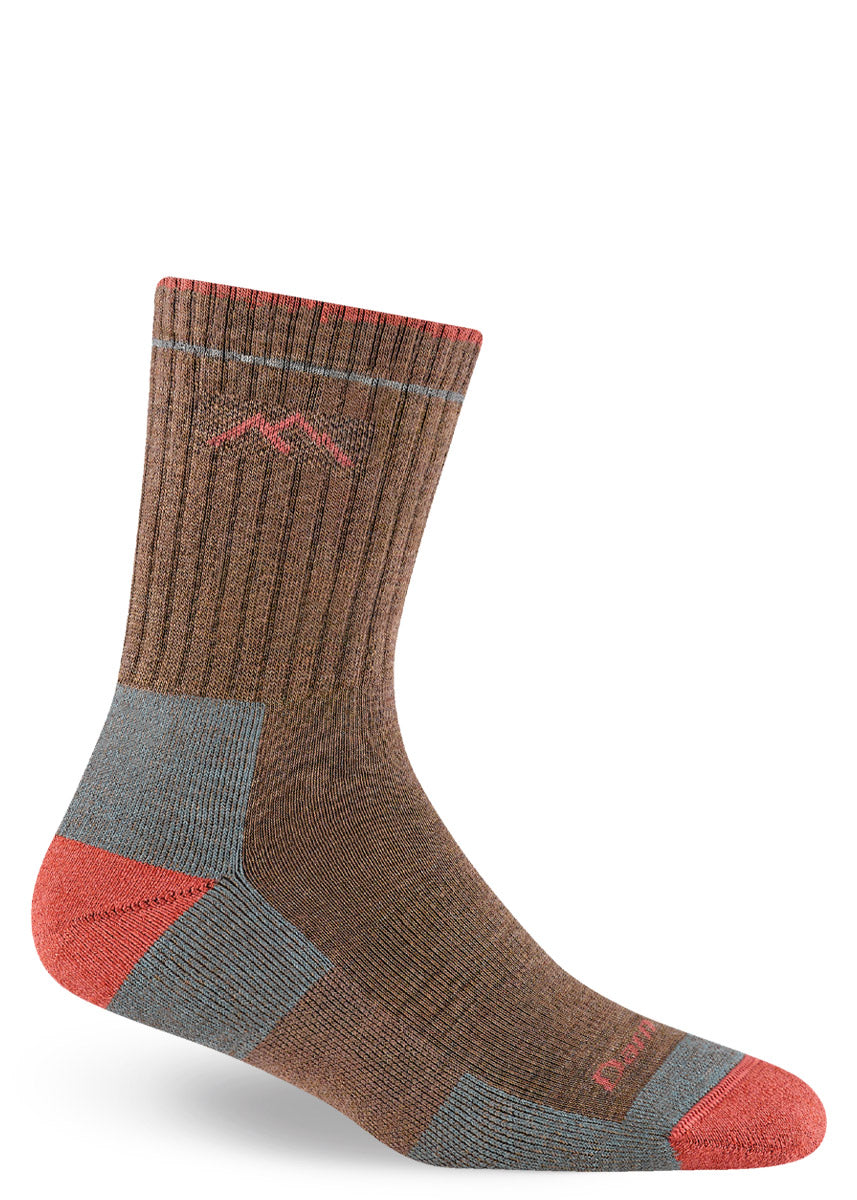 Crew-height cushioned merino wool hiking socks in brown with orange accents.