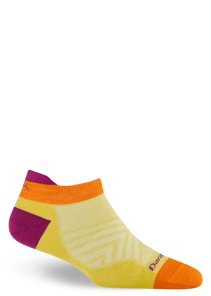 Yellow ankle sock with orange and purple accents on a white background.