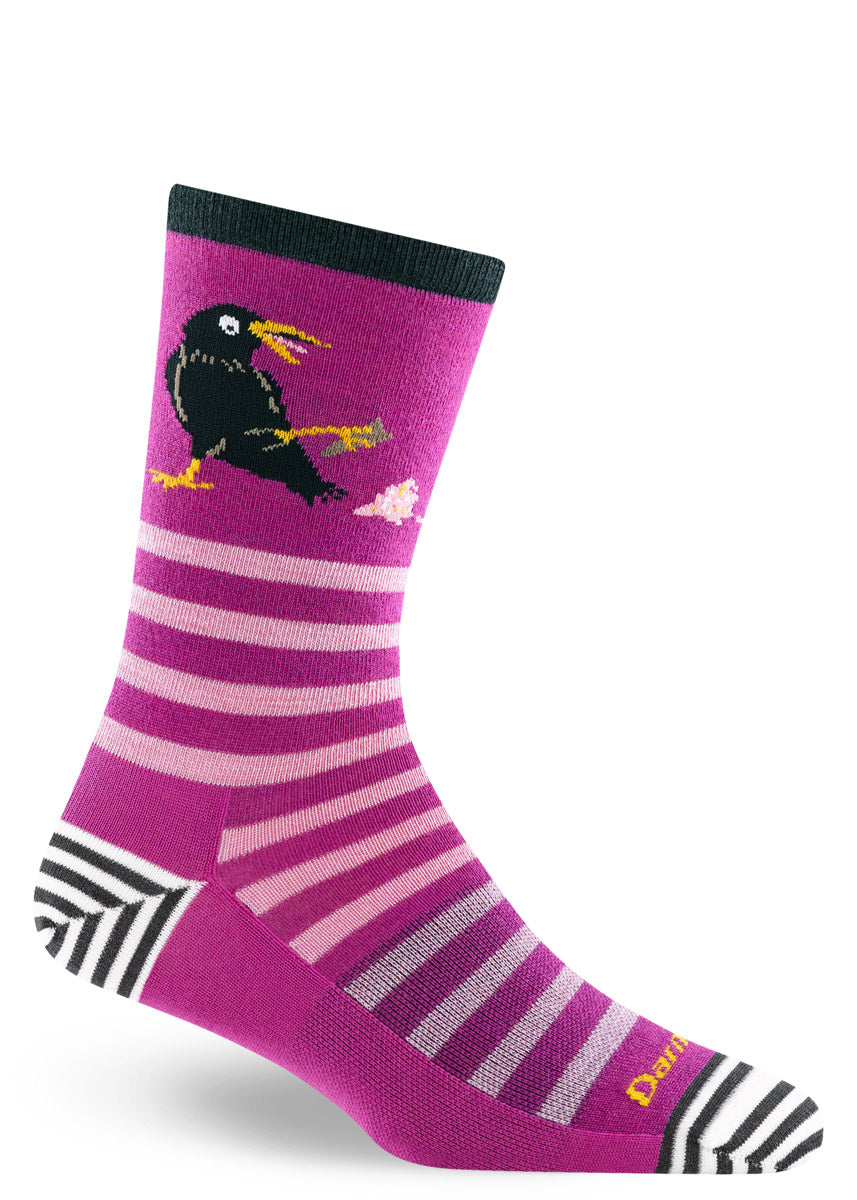 Purple striped wool crew socks for women with a design of a black crow accidentally dropping an ice cream cone.