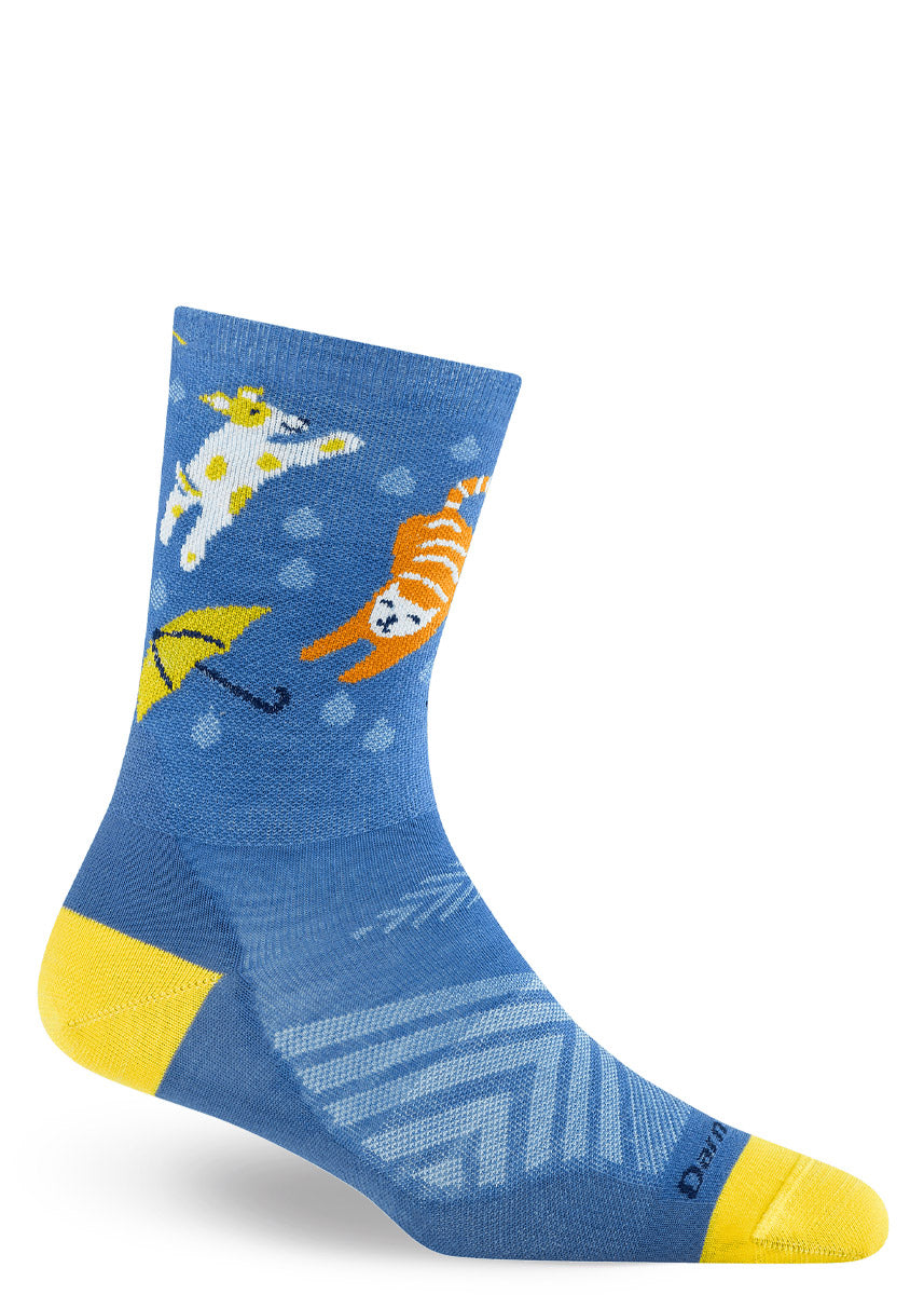 Blue crew sock with rainy-day cat and dog designs on a white background.