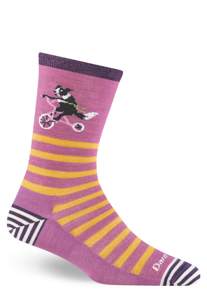 Purple and yellow striped crew socks for women with a sheep dog riding a pink bicycle and purple and white striped accents on the toe and heel.