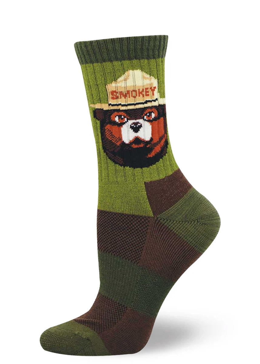 Wool women's crew sock with Smokey Bear design and in shades of green and brown.