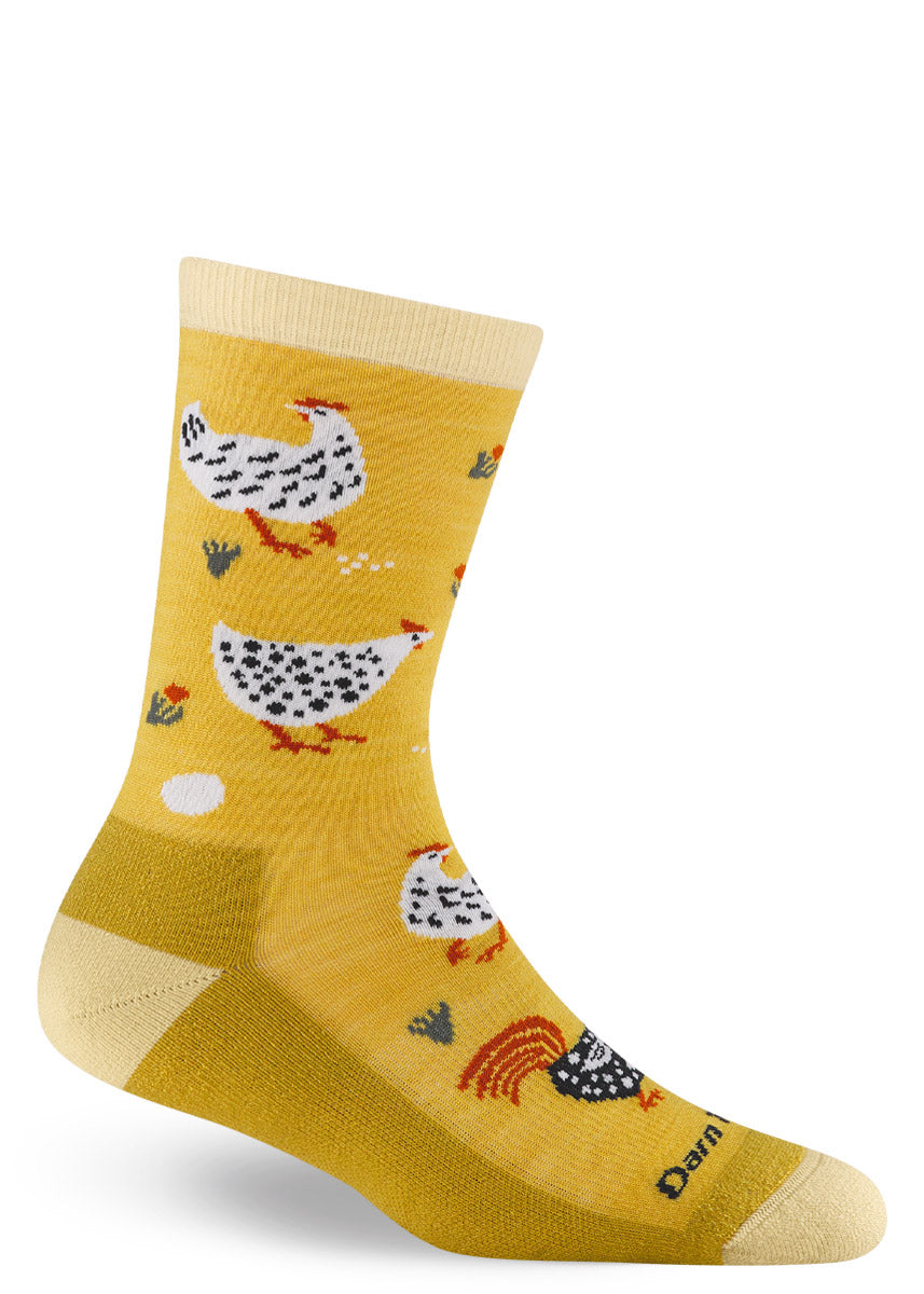 Yellow crew sock with black and white chicken design on a white background.