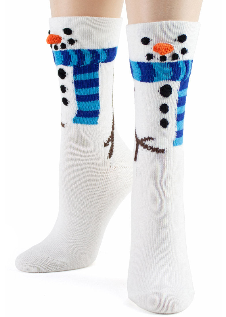 White crew socks with a 3D knitted carrot nose, coal buttons, mouth and eyes to make your feet look like snowmen.