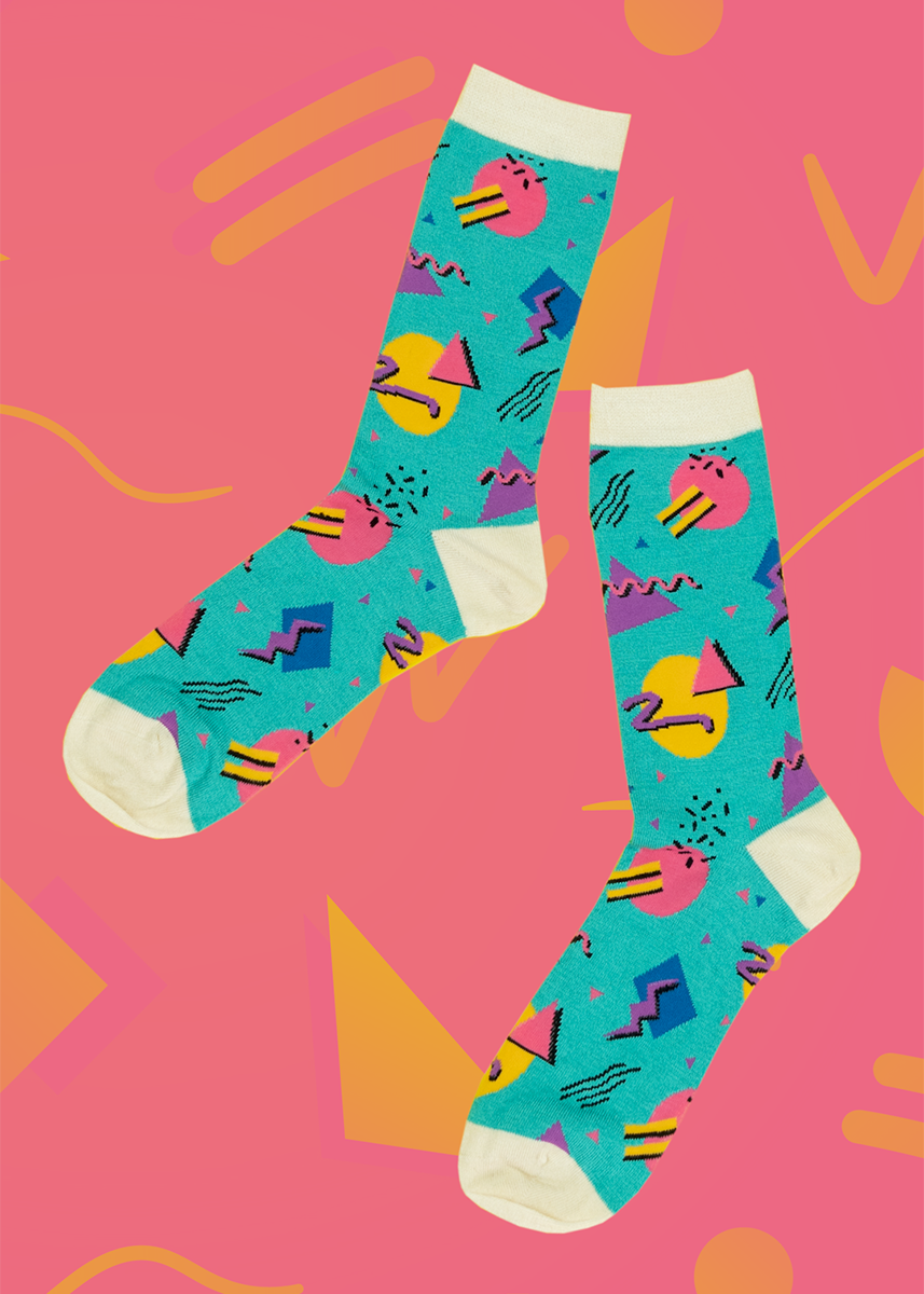 Bright teal socks with geometric vintage shapes, and lines. Heel, toe , and top of the socks are white!