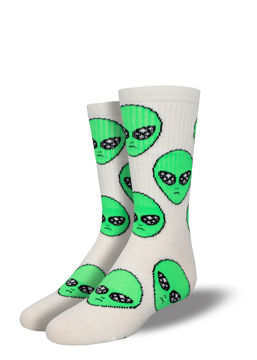 Fun white athletic socks for kids covered in green alien faces.