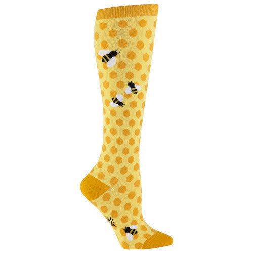 Knee-high bee socks for women with bees and honeycomb yellow background