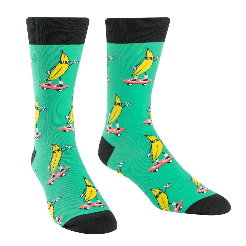 A bunch of bananas in sunglasses skateboard on these men's socks.