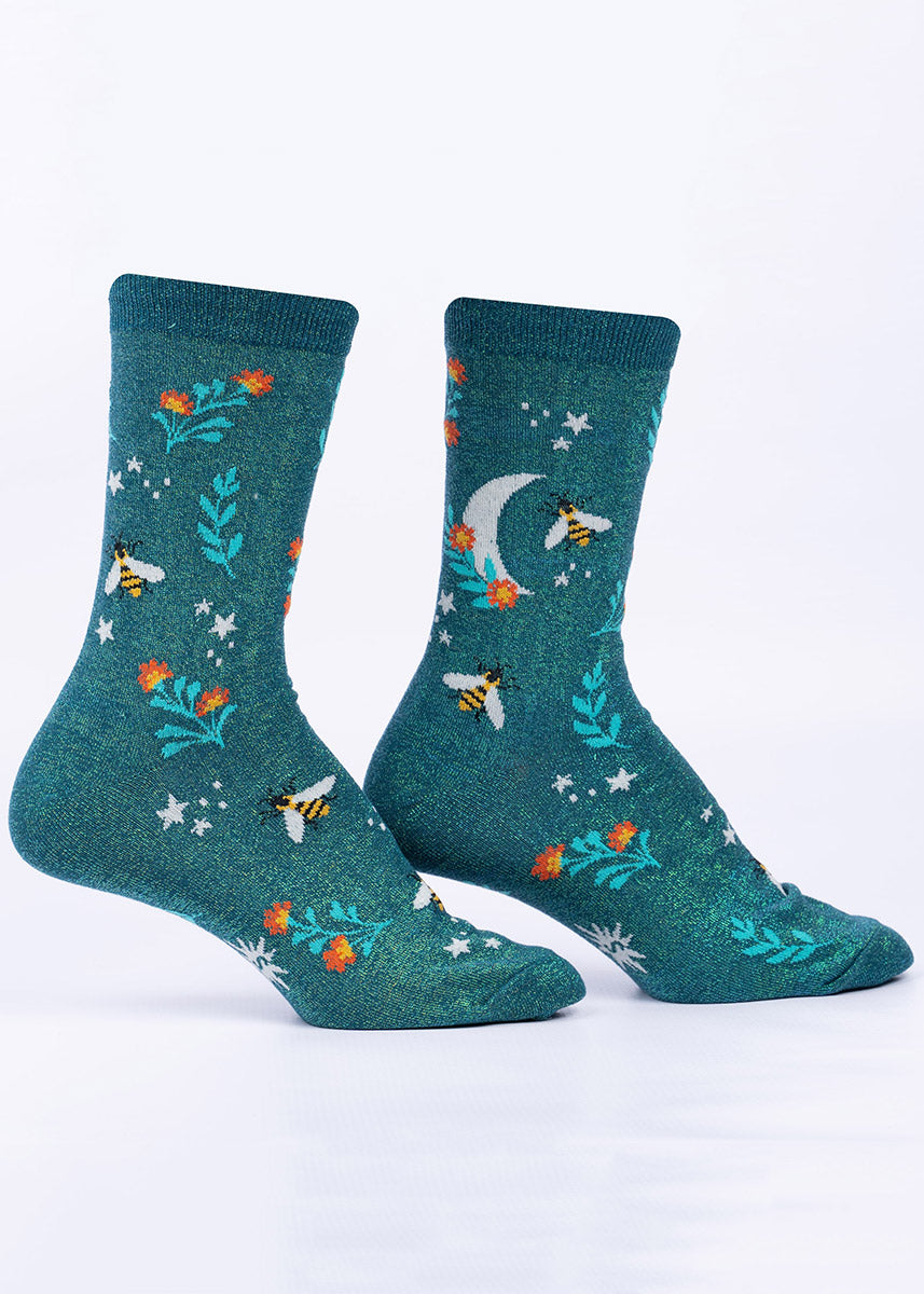 Teal women's crew socks with shimmer thread, embellished with a pattern of bees, crescent moons, stars and flowers.