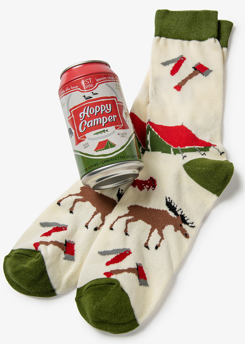 Camping socks for men feature a design of a moose, tents, and tools like a hammer and pocket knives, and comes packaged inside a beer can that says &quot;Hoppy Camper.&quot;