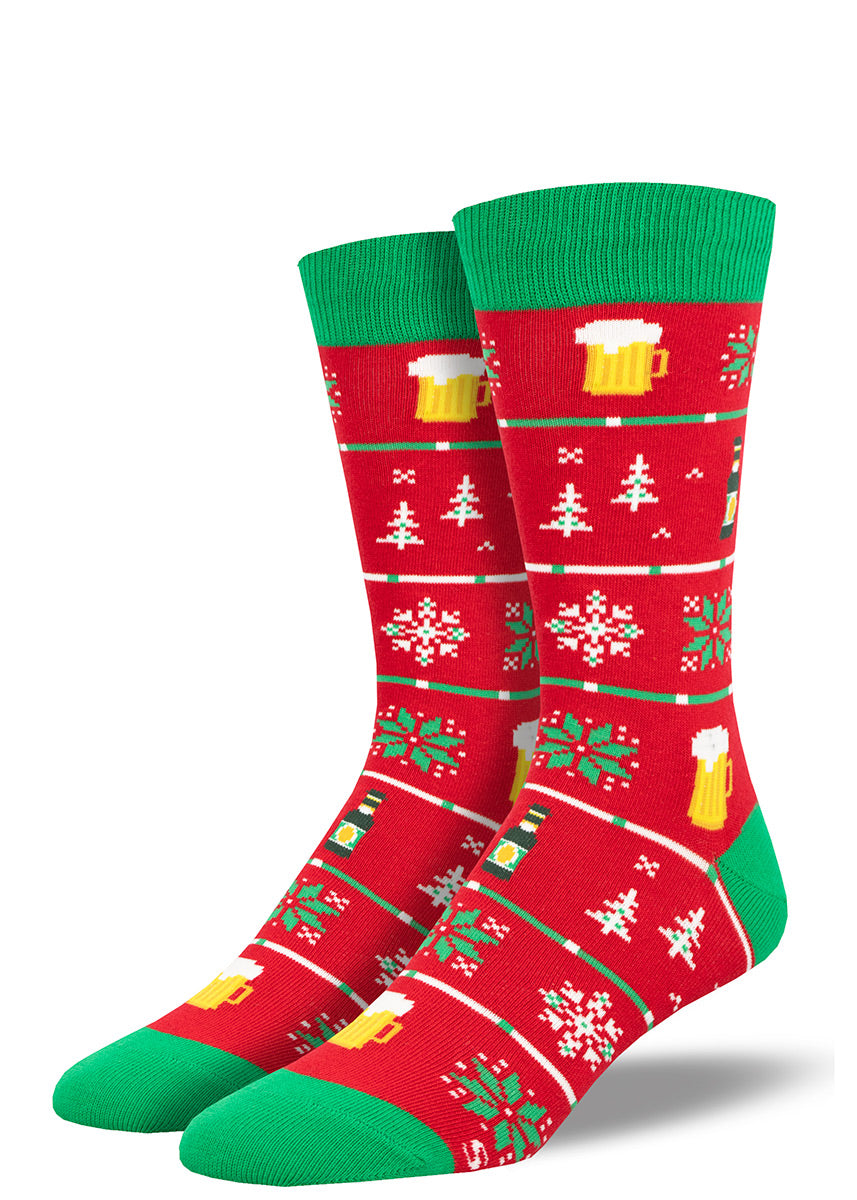 Red men's Christmas-themed crew socks with green accents feature the usual holiday motifs of trees and snowflakes alongside the unexpected addition of beer depicted in mugs and bottles.