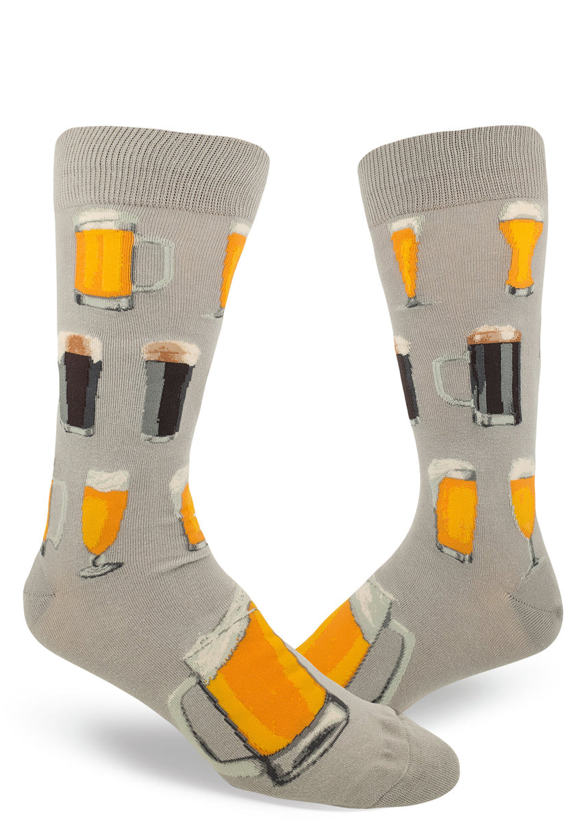 Beer socks for men with dark brown beer and amber beer in different shaped beer glasses on a gray background