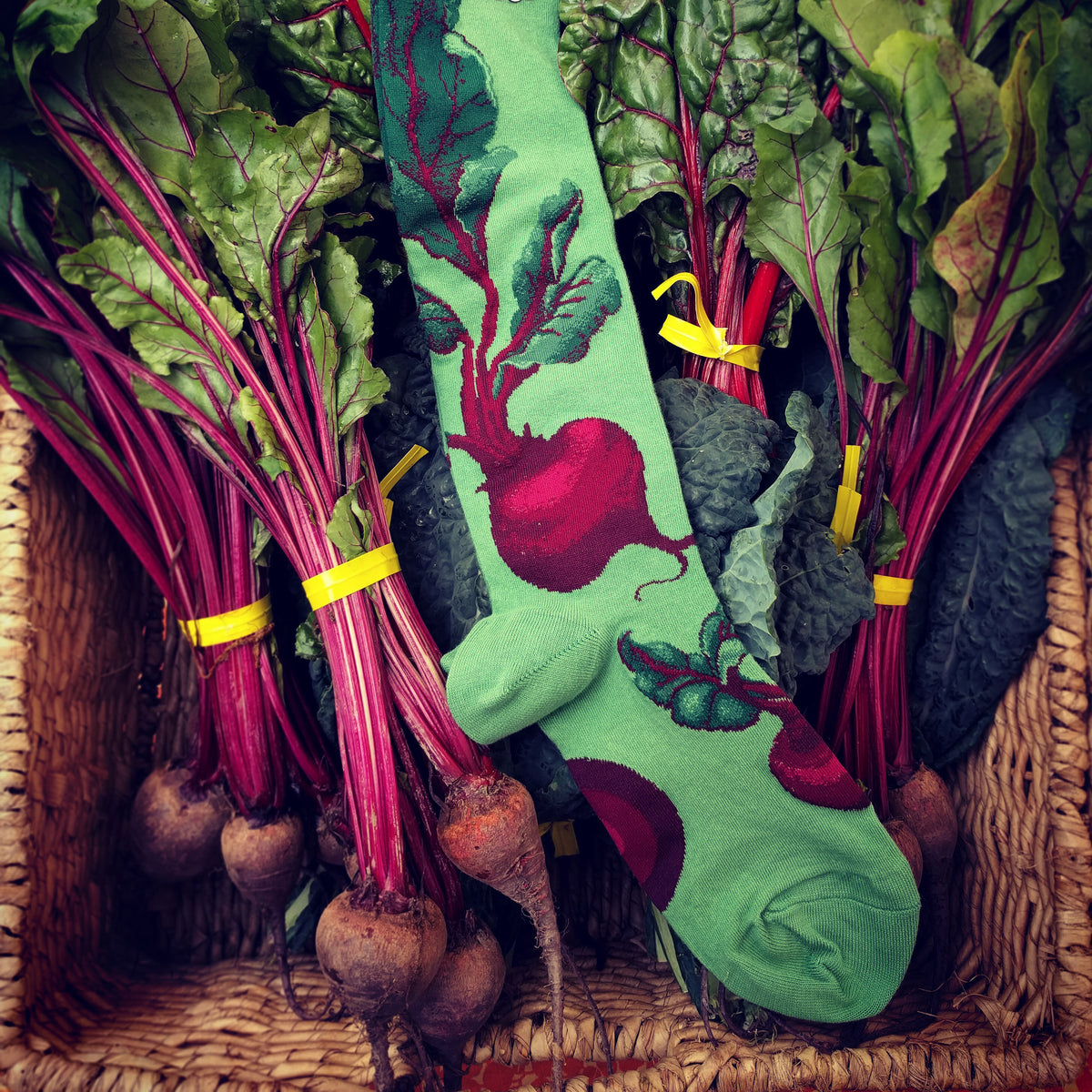 Red beets on a green knee sock — the perfect socks for a Saturday at the farmers market.